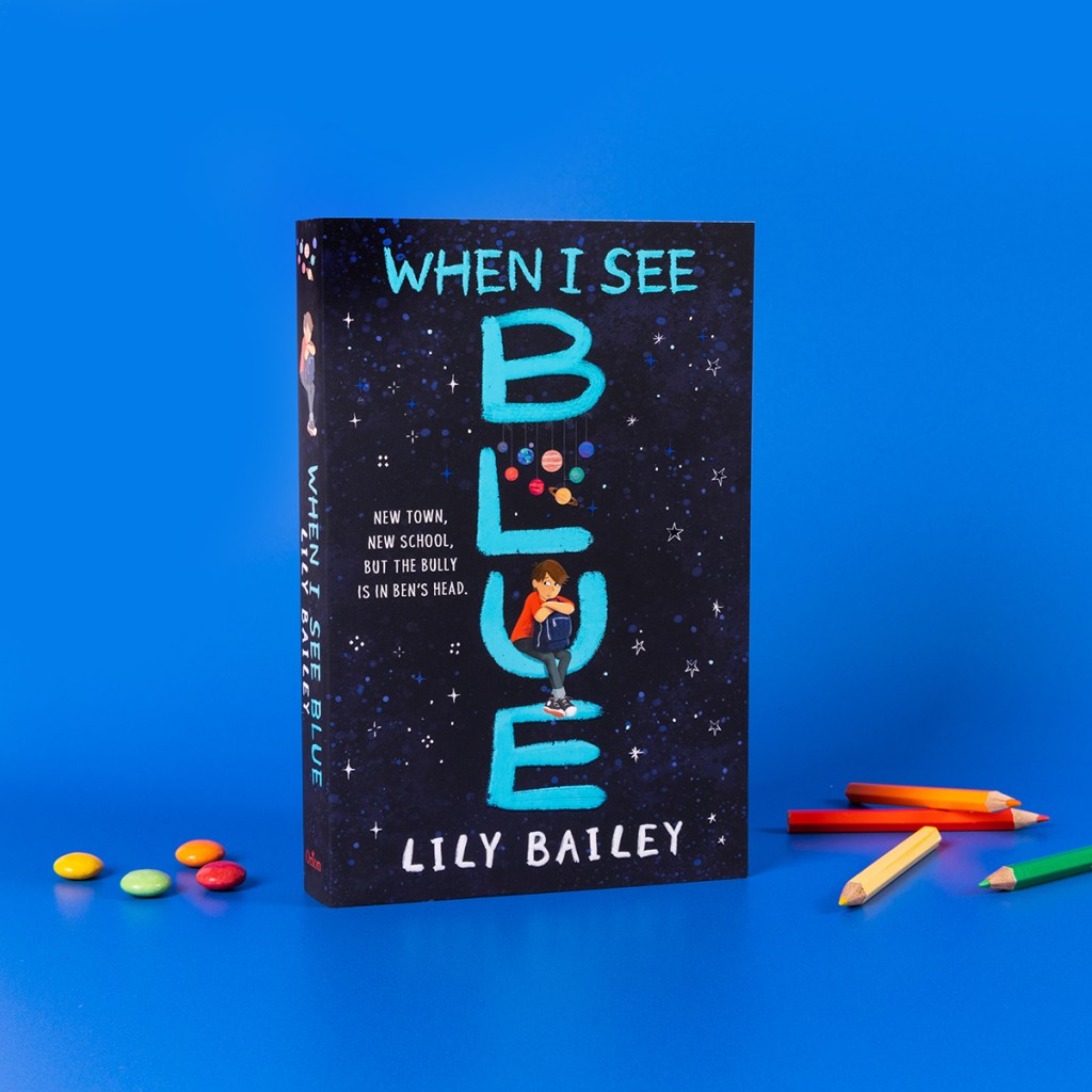 Image of When I See Blue paperback against a dark blue background